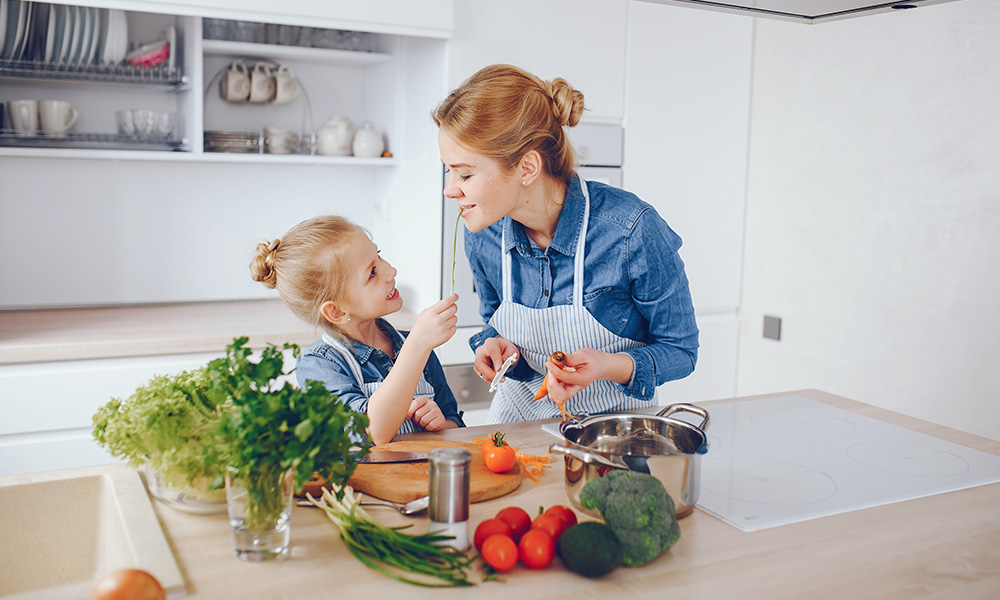 mother with daughter in the kitchen