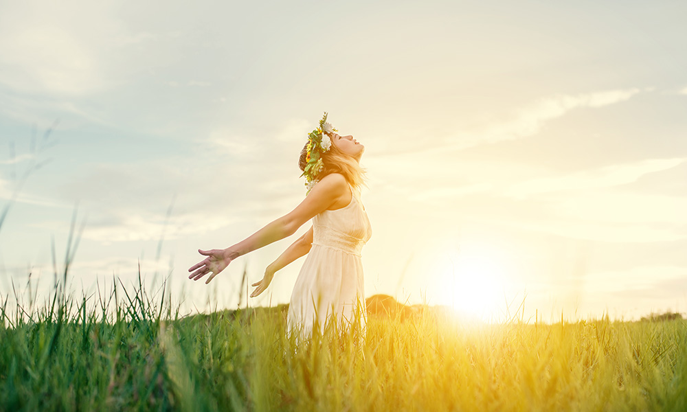 Freedom concept : Young beautiful woman enjoying with fresh air
