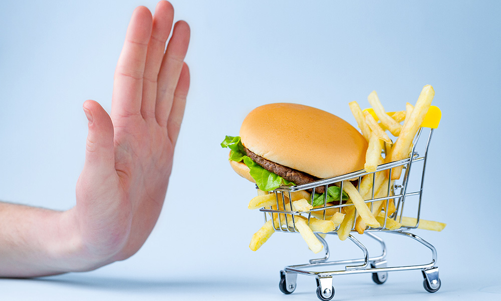 Food and diet concept. French fries and hamburger for snack. Fas